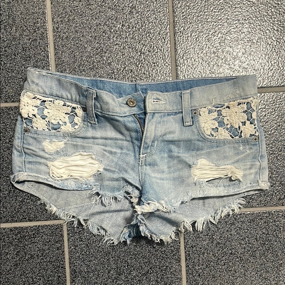 Distressed Light Blue Denim Shorts with Lace Accents